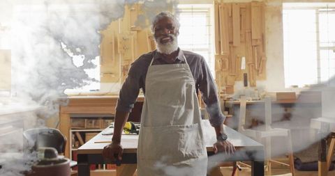 Smiling Carpenter Posing Proudly in Woodworking Workshop