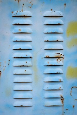 Rusty industrial metal vents with weathered texture