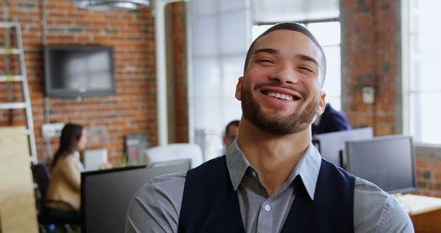 Smiling Man with Beard in Modern Office - Download Free Stock Images Pikwizard.com