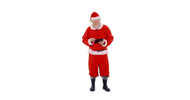 Santa Claus Using Digital Tablet While Standing Against White Background - Download Free Stock Images Pikwizard.com