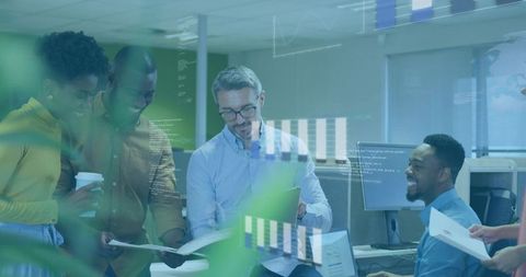 Collaborative team reviewing data and charts in modern open-plan office workspace