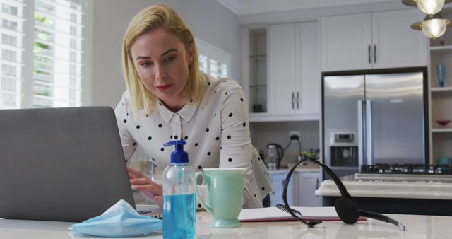 Woman Working from Home in Kitchen with Laptop and PPE - Download Free Stock Images Pikwizard.com