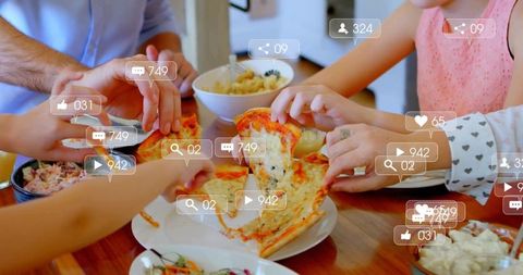 Family Enjoying Pizza Meal Sharing Moments Together
