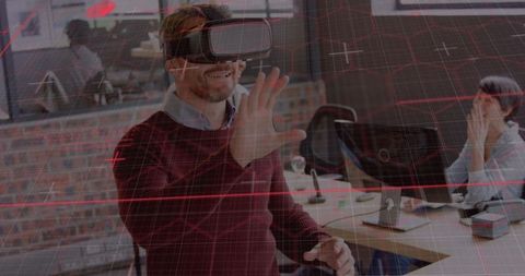 Man interacting with augmented reality technology in office