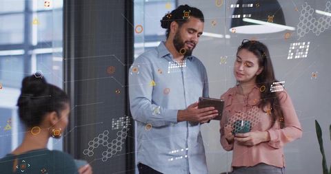 Collaboration in modern office with data visualization elements