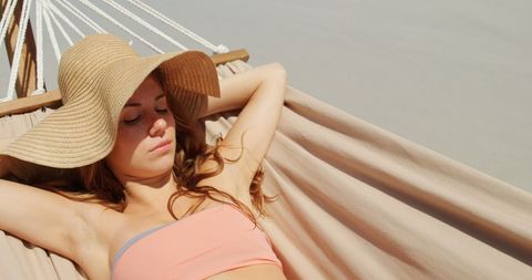 Caucasian Woman Relaxing Peacefully in a Beach Hammock on a Sunny Day - Download Free Stock Images Pikwizard.com