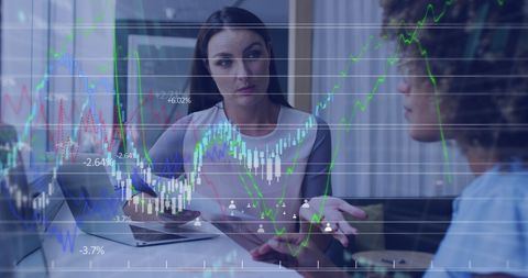 Business analysis with diverse team and digital charts in modern office