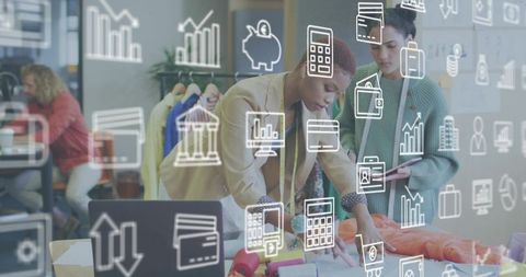 Retail team reviewing fabric swatches and merchandising plans with digital icons overlay