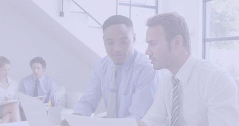 Diverse Businessmen Collaborating at Modern Office