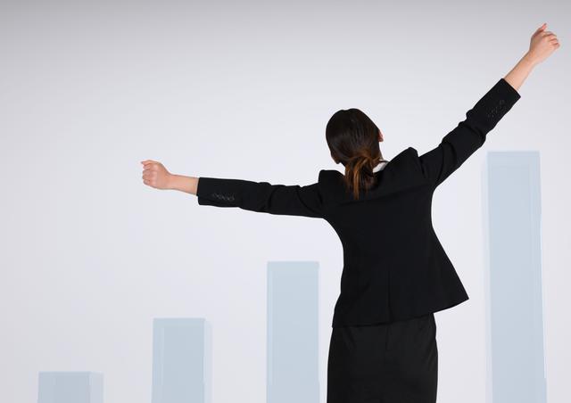 Businesswoman celebrating increasing success with arms raised, back view against a growing bar chart in background. Image suitable for illustrating themes of business growth, financial success, professional achievements, and career triumph. Perfect for use in presentations, corporate websites, blogs, and advertisements focused on success and progression.