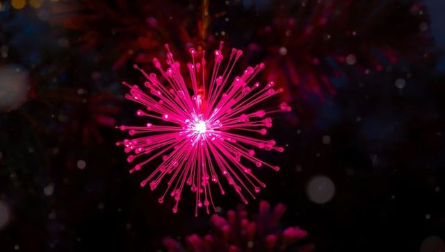 Magenta fiber-optic lamp with radiant glowing filaments