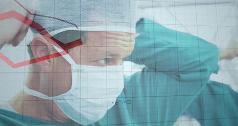 Surgeon Reviewing Declining Statistics in Operating Room