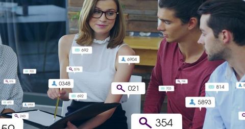 Female team leader presenting digital analytics overlays during collaborative office meeting