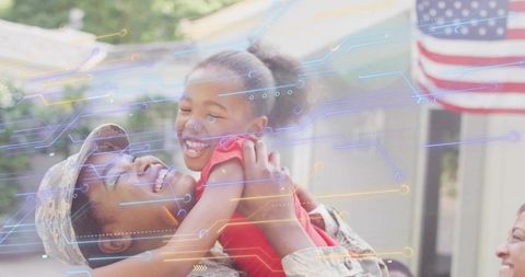 Soldier reuniting with smiling child on front porch, american flag waving, tech overlay