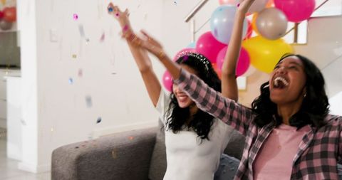 Joyful Celebration with Friends and Balloons Indoors