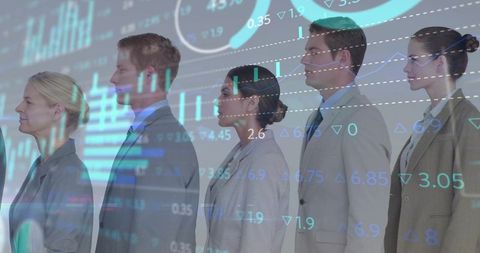 Corporate team standing in line with stock market data overlay illustrating finance and analytics