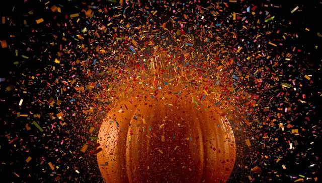 Dramatic Pumpkin Explosion with Glittering Confetti Shards
