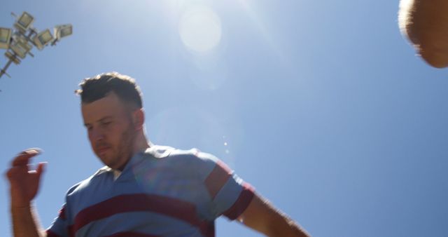 Man in Casual Striped Shirt Outdoors Under Sunny Sky - Download Free Stock Images Pikwizard.com