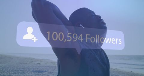 Silhouette of Man Stretching on Beach with Social Media Overlay