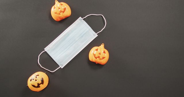 Halloween Pumpkins Surrounding Face Mask on Black Background - Download Free Stock Images Pikwizard.com