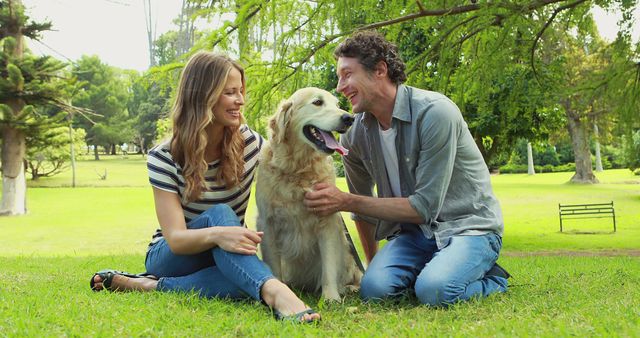 Happy Couple Enjoying Time with Golden Retriever in Park - Download Free Stock Images Pikwizard.com