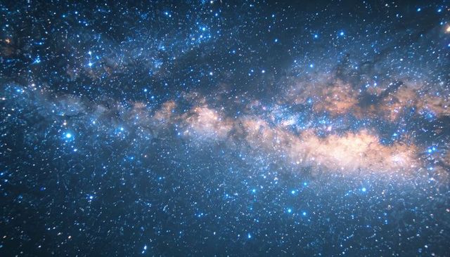 Milky Way band stretching across starry night sky with glowing nebulae and dust lanes