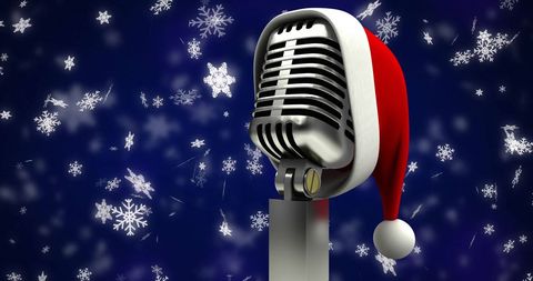 Vintage Microphone with Santa Hat Amidst Falling Snowflakes