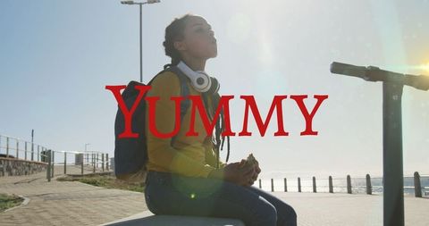 Woman Enjoying Healthy Snack at Sunny Beachfront
