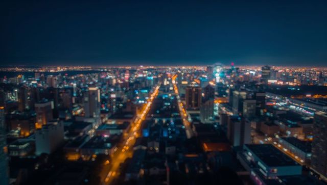 Nighttime cityscape with illuminated streets