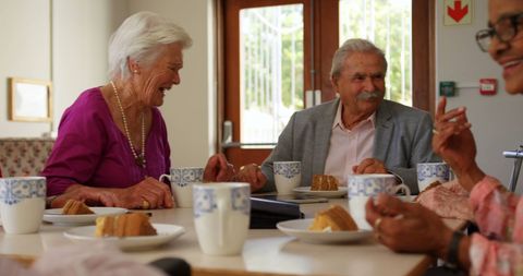 Senior Friends Enjoying Coffee and Laughter Around Table - Download Free Stock Images Pikwizard.com