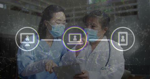 Masked clinicians reviewing tablet with telemedicine interface and network overlay in clinic