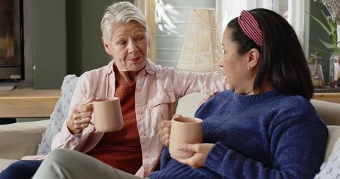 Senior Friends Enjoying Coffee and Heartfelt Conversation