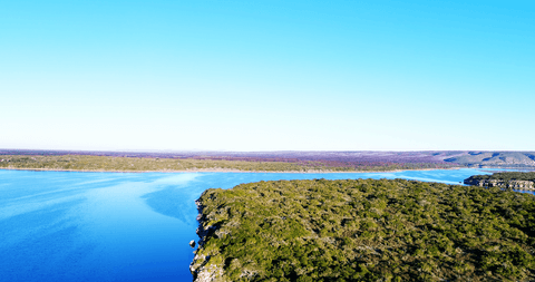 transparent sky over serene river and greenery panorama - Download Free Stock Videos Pikwizard.com
