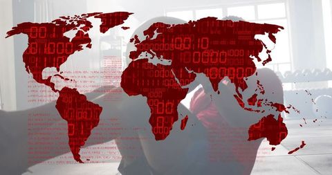 Backlit man sitting hugging knees in gym with red digital world map overlay