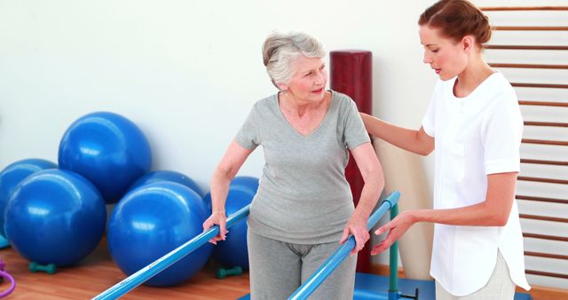 Elderly Woman Undergoing Physical Therapy with Young Caregiver - Download Free Stock Images Pikwizard.com