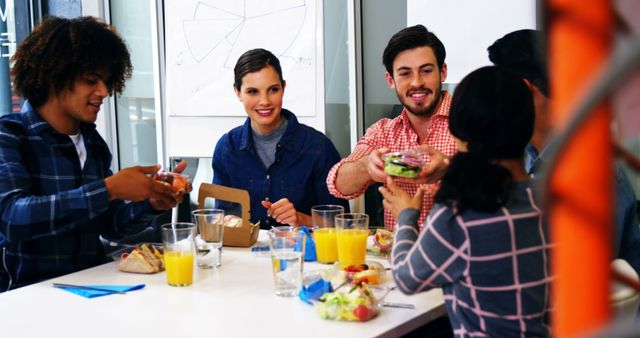 Diverse Team Enjoying Lunch Together in Office Break Room - Download Free Stock Images Pikwizard.com