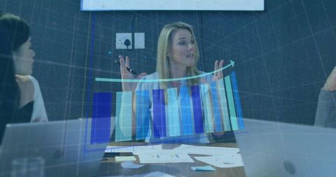Confident Businesswoman Leading Team Discussion with Data Visualization