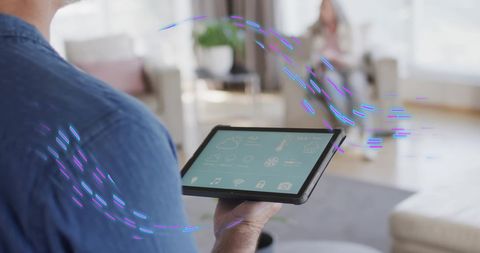 Man Using Smart Home Interface on Tablet with Digital Effects - Download Free Stock Images Pikwizard.com