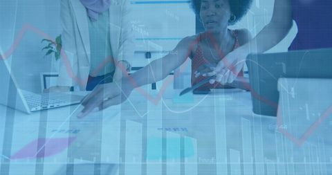 Diverse Business Professionals Analyzing Data for Strategic Insights