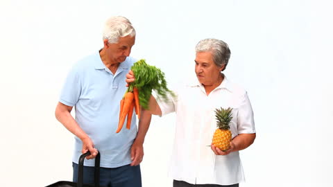 Senior Couple Shopping Local Produce White Background