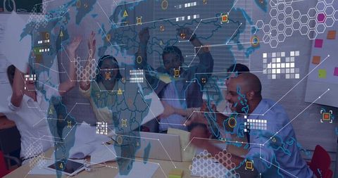 Team celebrating success around conference table with global data visualization overlay