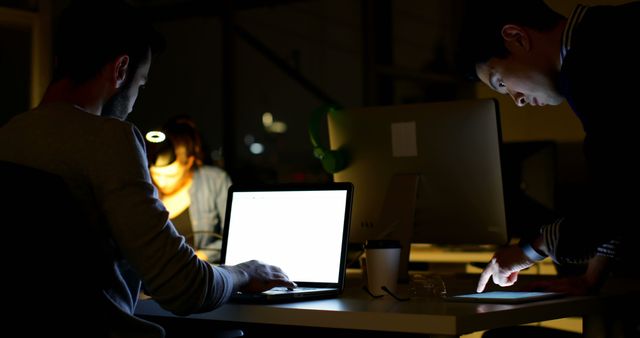 People Working Late on Computers in Dim Office - Download Free Stock Images Pikwizard.com