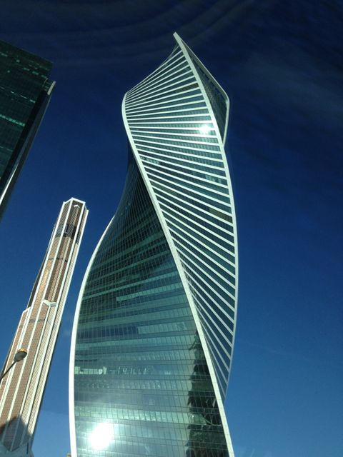 High-rise Modern Skyscraper under Clear Blue Sky - Download Free Stock Photos Pikwizard.com