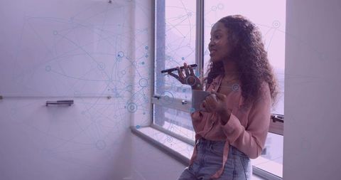 Businesswoman Utilizing Voice Command Technology in Modern Office