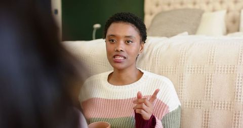 Woman Relaxing with Mug in Cozy Bedroom Setting