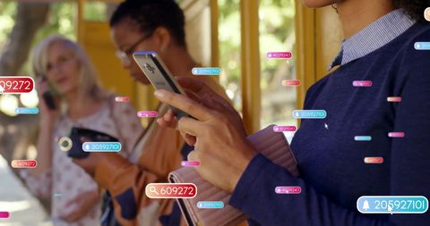 Social media engagement at bus stop as diverse women connect digitally