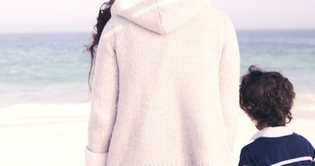 Mother and Child Walking on Beach in Autumn - Download Free Stock Images Pikwizard.com