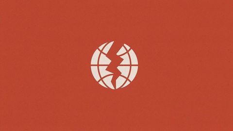 Cracked globe on red canvas symbolizing global issues