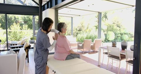 Therapist Providing Home Rehabilitation for Senior Woman