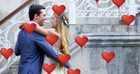 Romantic Newlyweds Surrounded by Floating Heart Balloons